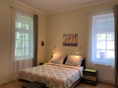 Postel nebo postele na pokoji v ubytování ML Apartment