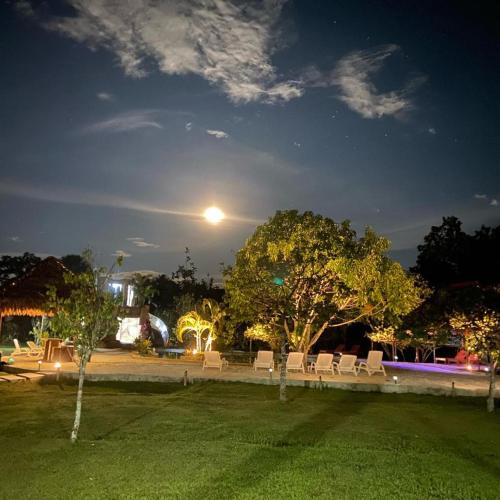 a park at night with the moon in the sky at Saraya Lodge & Camping in Iquitos