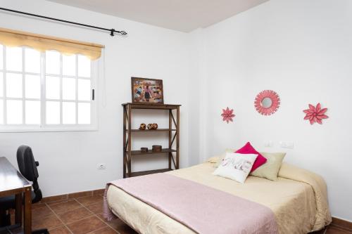 Postel nebo postele na pokoji v ubytování Home2Book Charming Apartment Los Realejos