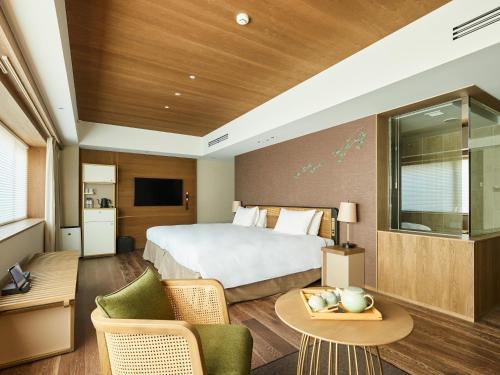 Voodi või voodid majutusasutuse GOOD NATURE HOTEL KYOTO toas