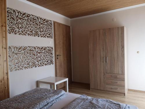 Cama o camas de una habitación en Relax Apartman
