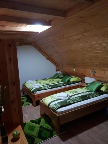 A bed or beds in a room at PLITVICE FAIRYTALE