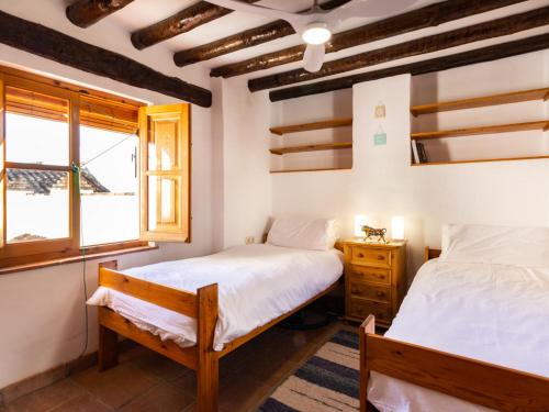 A bed or beds in a room at Casa del patio arabe