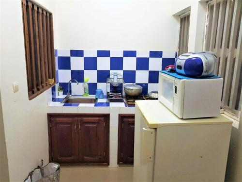 Η κουζίνα ή μικρή κουζίνα στο Charming apartment in M'bour + 100 m² + pool