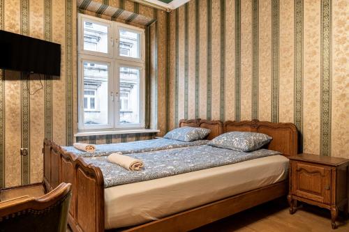 En eller flere senger på et rom på Dream Aparts - Apartament Krolewski