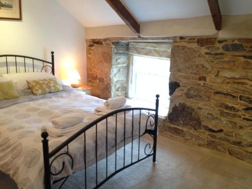 Ένα ή περισσότερα κρεβάτια σε δωμάτιο στο Jowders Cottage