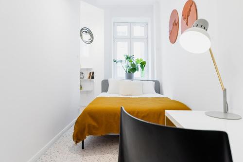 Posteľ alebo postele v izbe v ubytovaní Warsaw Concierge Koneser