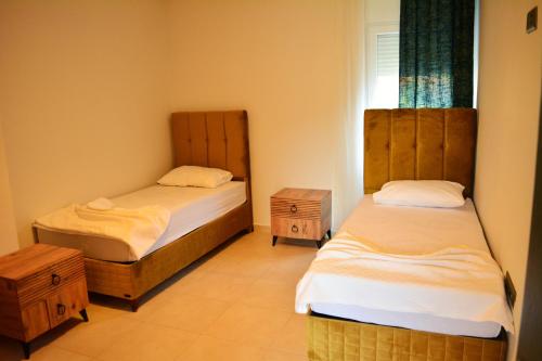 Кровать или кровати в номере Kemer Babel Residence