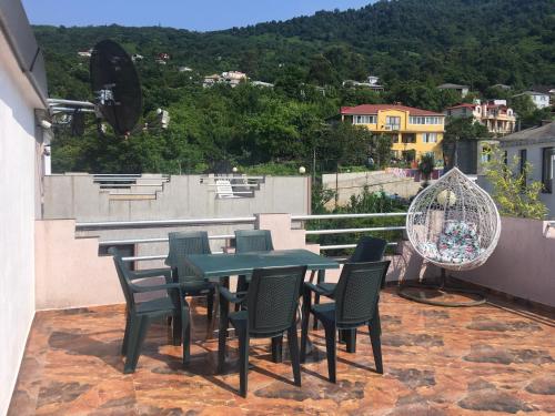 a table and chairs on a balcony with a view at Aparthotel Sofia in Gonio in Gonio
