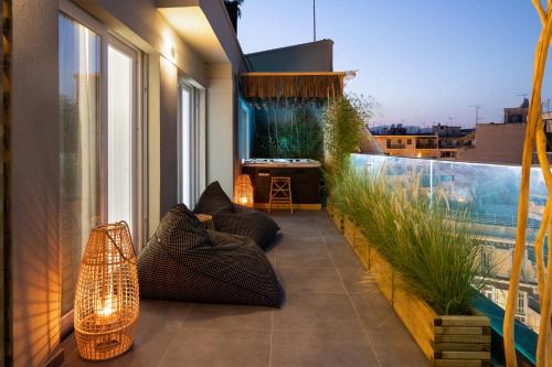a balcony with a view of a swimming pool at Athens Warehouse Boutique Hotel & Suites in Athens