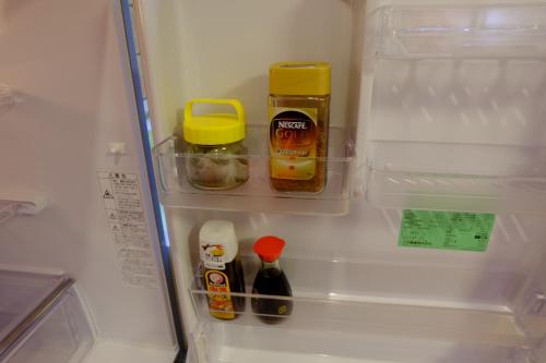 a refrigerator filled with food and condiments at Villa Ensoleille in Fujikawaguchiko