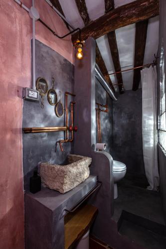 a bathroom with a sink and a toilet at NATURA rooms&sport in Finale Ligure