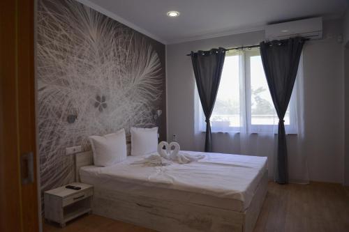 Postel nebo postele na pokoji v ubytování Guest House ERIDA