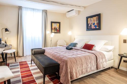 Postel nebo postele na pokoji v ubytování Hotel La Mère Germaine