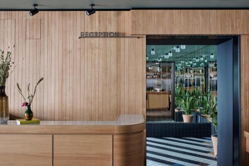 an entrance to a restaurant with a sign that reads reception at Schwan Locke in Munich