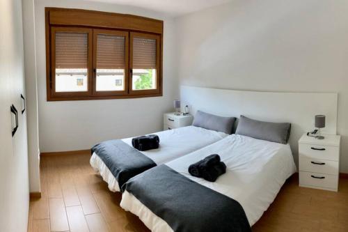 Un pat sau paturi într-o cameră la Apartamento Bricia