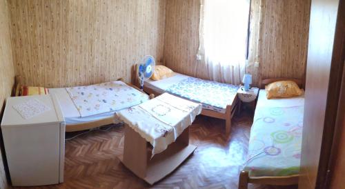 En eller flere senge i et værelse på Guest House - Marija Delija
