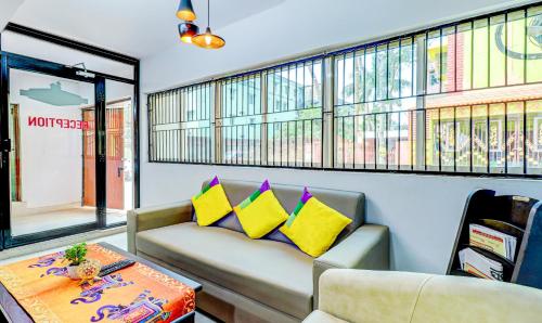 a living room with a couch and a table at Itsy Hotels Aasma Luxury Villa in Bhubaneshwar