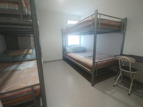 Voodi või voodid majutusasutuse Simple Stay Miyajima toas