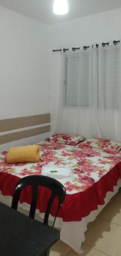 A bed or beds in a room at Hospedaria Ipiranga
