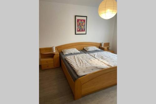 a bedroom with a bed and a lamp in a room at Ferienwohnung Wille in Climbach