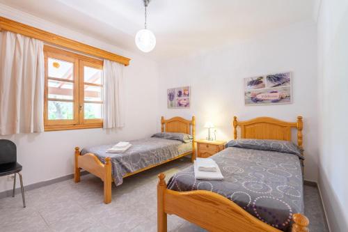 Postel nebo postele na pokoji v ubytování Villa la Rafal