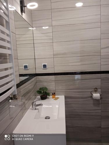 a bathroom with a sink and a mirror at HAVANA in Lublin