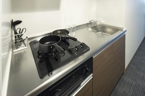 Kuchyň nebo kuchyňský kout v ubytování Coruscant Hotel NagasakiekiⅢ