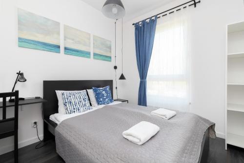 Posteľ alebo postele v izbe v ubytovaní Nowa Letnica Apartments by Noclegi Renters