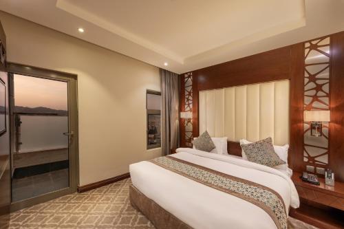 Ένα ή περισσότερα κρεβάτια σε δωμάτιο στο Sarwat Park Hotel