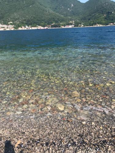 a large body of water with a rocky beach at Villa Angel in Kamenari