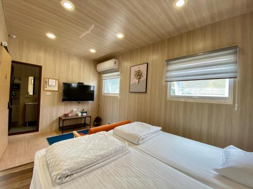 Postel nebo postele na pokoji v ubytování 放風Chill