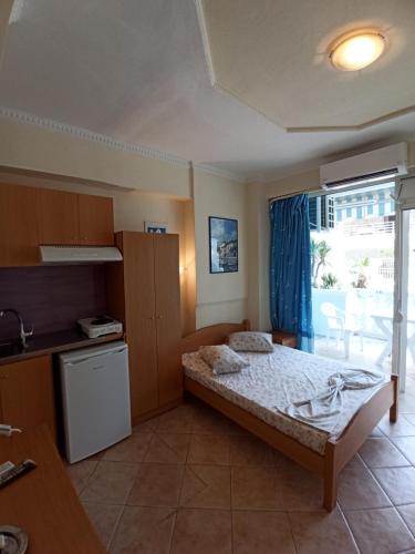 Postel nebo postele na pokoji v ubytování Villa Cosmos Inn