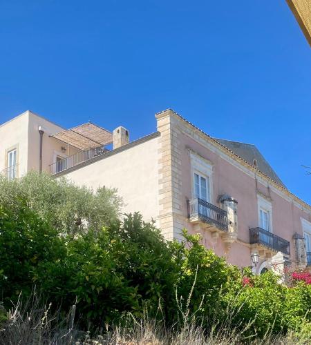 a building with a balcony on top of it at Villa in Gargano - VILLA BASSO in Monte SantʼAngelo