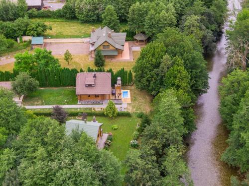 an aerial view of a house and a river at Log House The River Pearl in Brod na Kupi