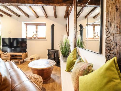 a living room with a couch and a table at Swallows Rest in Montgomery