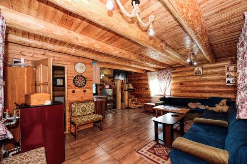 a living room with a couch and a table at Casa Maia in Vatra Dornei