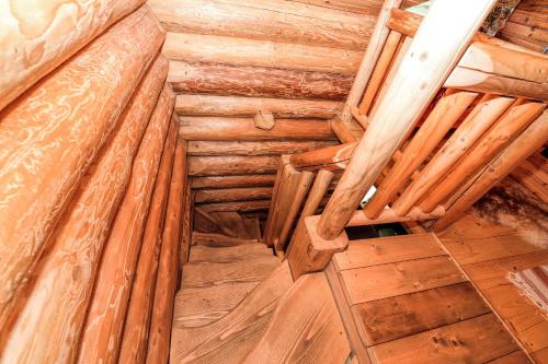an attic room with wooden walls and wooden floors at Casa Maia in Vatra Dornei