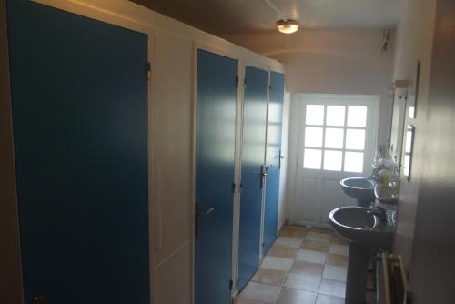 a bathroom with two sinks and two toilets at Le Domaine de JAUGY in Gièvres