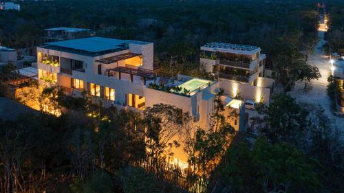 an aerial view of a house at night at Unho Tulum in Tulum