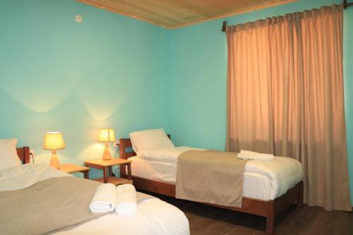 Un pat sau paturi într-o cameră la Gnishik Eco Resort