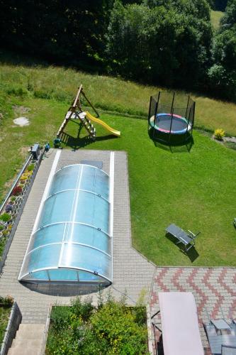 an aerial view of a playground with a trampoline at Penzion Benecko 171 in Benecko