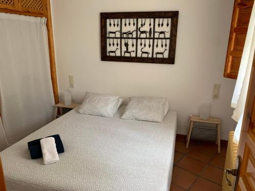 מיטה או מיטות בחדר ב-Acogedor Apartamento - La Alpujarra