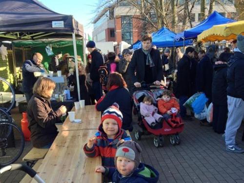 a group of people at an outdoor market at Charlotte Guest House in London