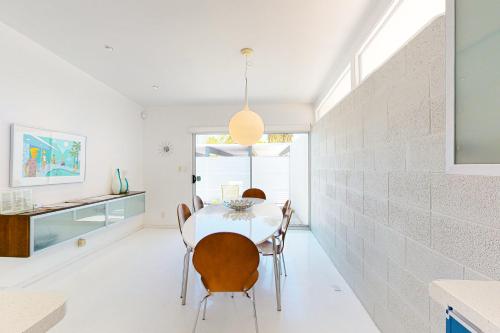 a dining room with a table and chairs at Poolside Modern Wexler Permit# 1261 in Palm Springs