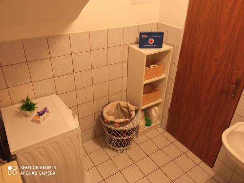 a bathroom with a toilet and a trash can at Yellow Rose in Rakovica