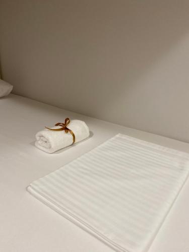 a white table with a towel and a napkin at Villa Klara in Novi Sad