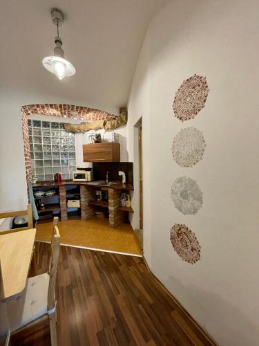 a living room with a wall with drawings on it at Ubytování v soukromí Bělčice in Bělčice