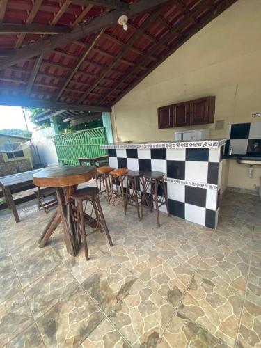 a group of tables and chairs in a kitchen at Pousada Encantos da Amazônia in Alter do Chao