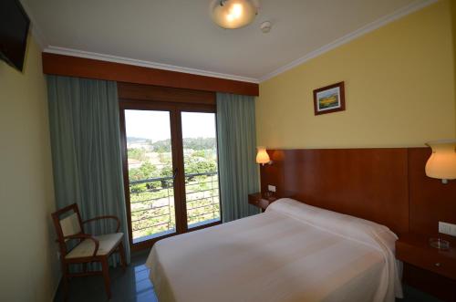 Cama o camas de una habitación en Hotel Maracaibo